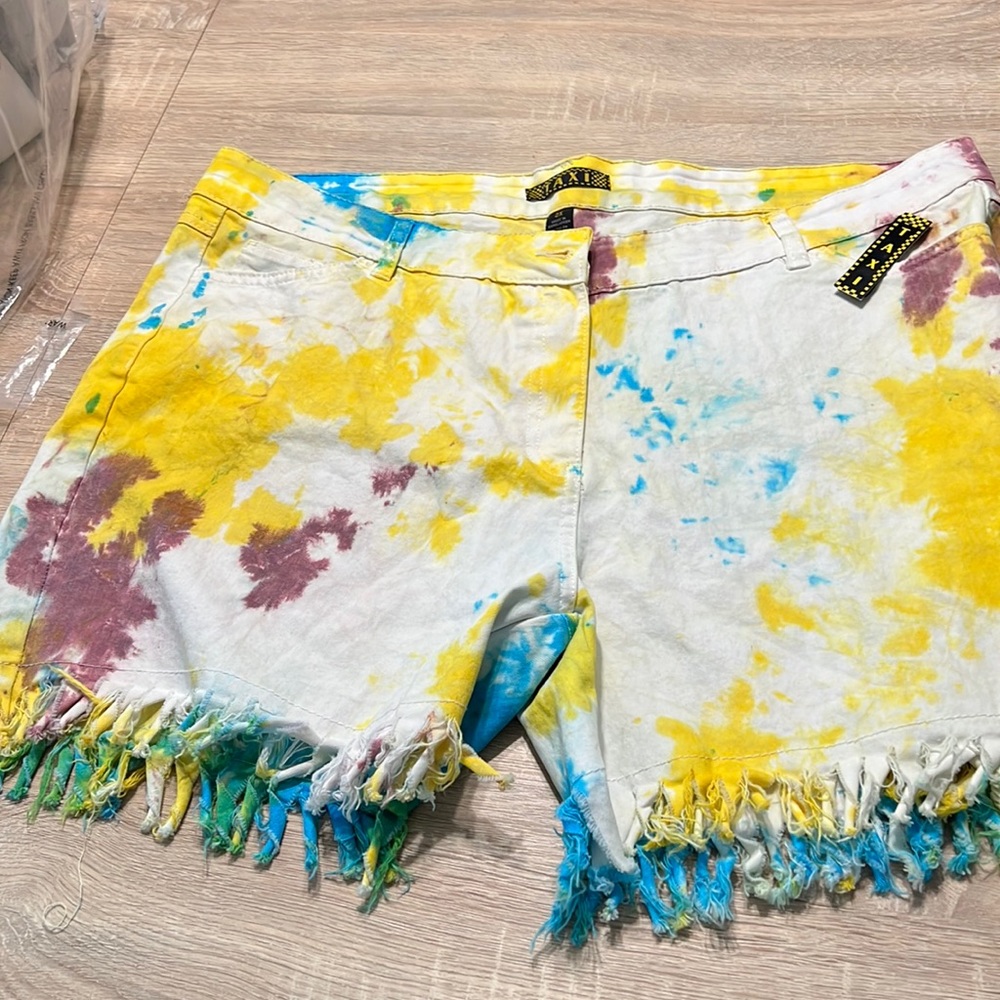 Taxi tie died stretch shorts with fringe.  Front and back pockets.